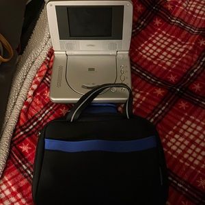 Portable DVD player still works brand new come with charger a remote control
